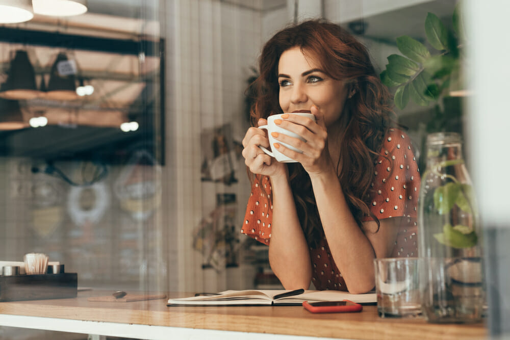 Woman drinking a mug of coffee